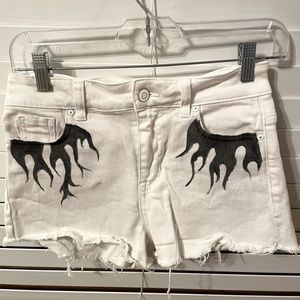 White and black flame painted white jean shorts